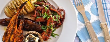 Octopus in red wine with fan potatoes